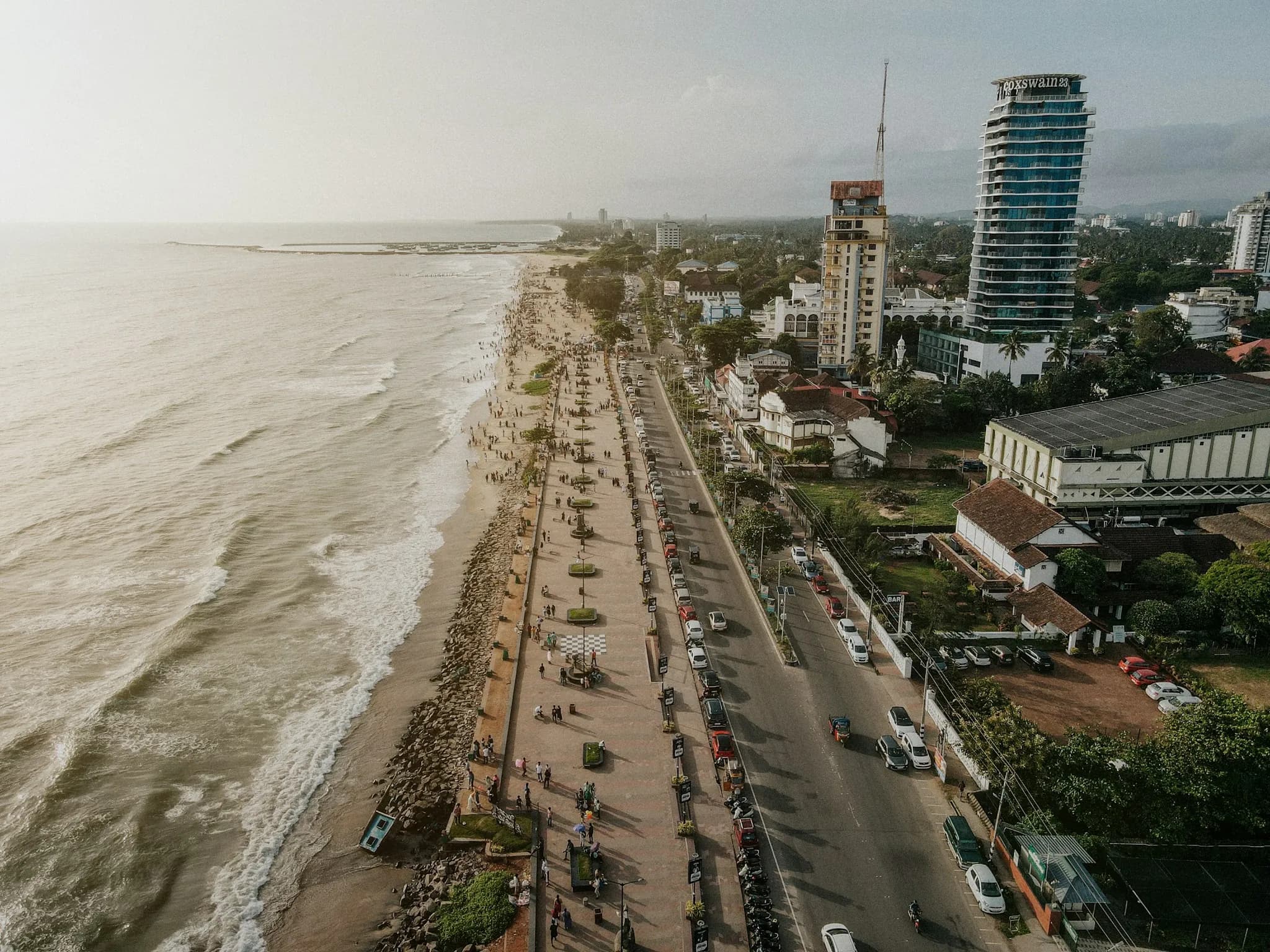 Aerial view of a beach road and the city