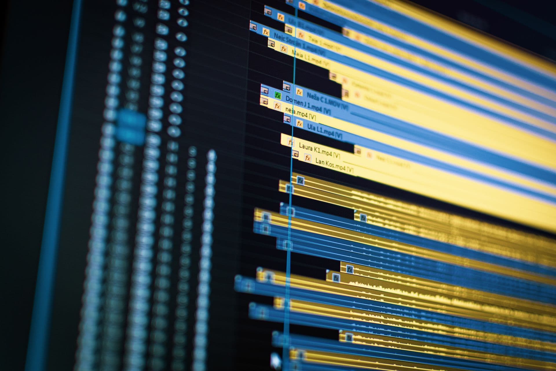 Close-up of a video editing timeline with yellow and blue clip tracks