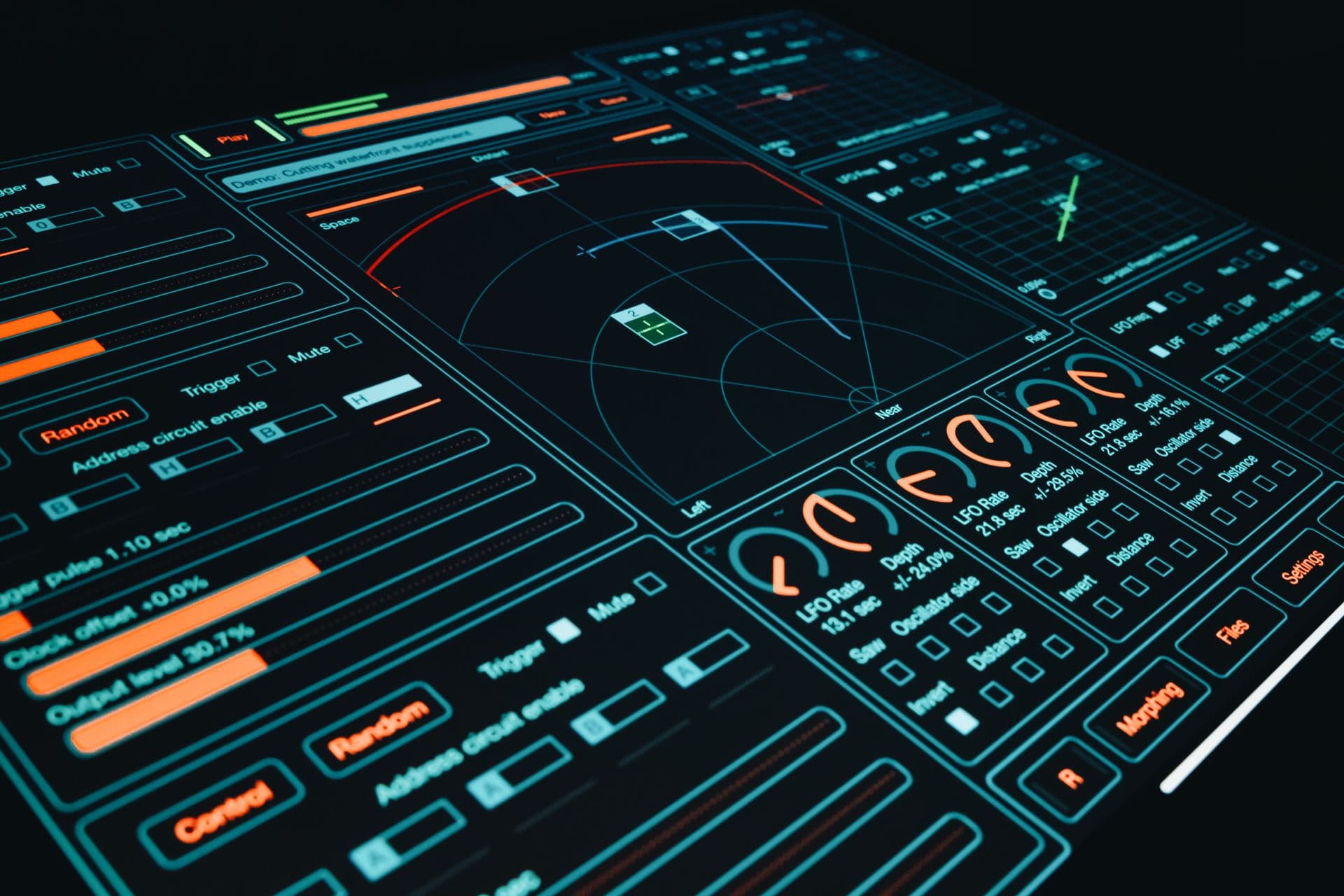 Dark touchscreen interface with glowing orange sliders, dials and control buttons